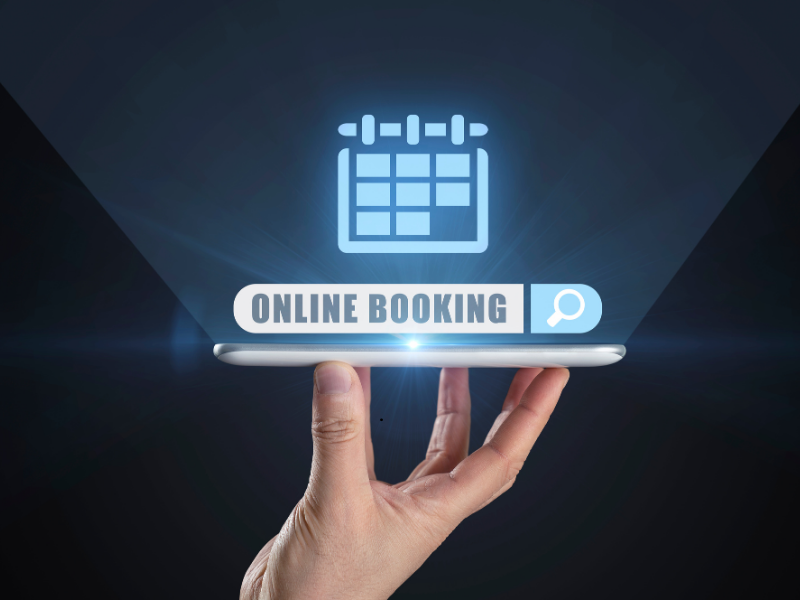 A hand holding a glowing Online Booking search bar with a calendar icon