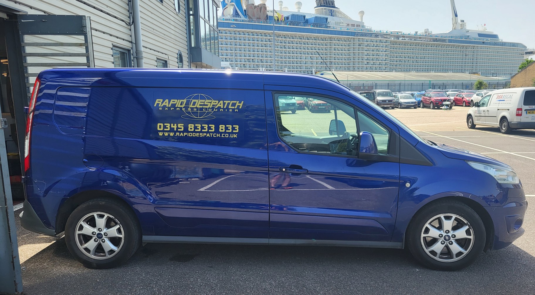 A Rapid Despatch van outside the Southampton branch, with a cruise ship in the dock behind