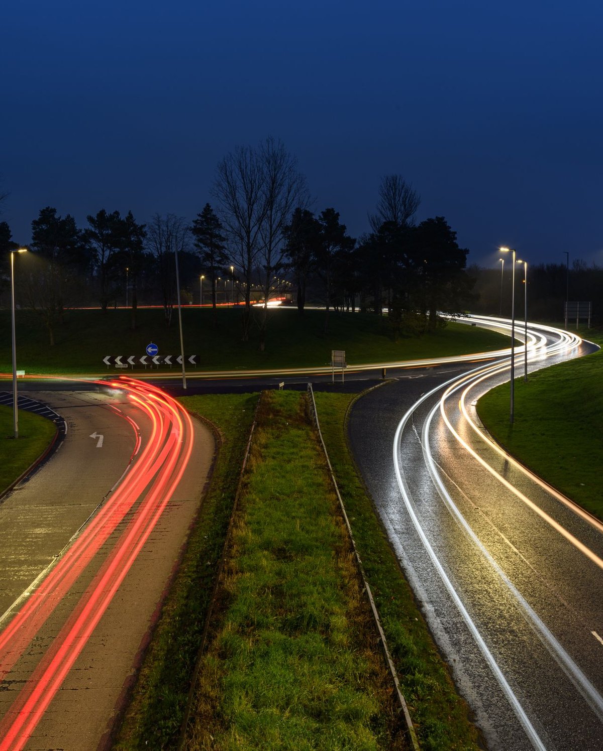 Light trails from traffic on a dual carriageway at night