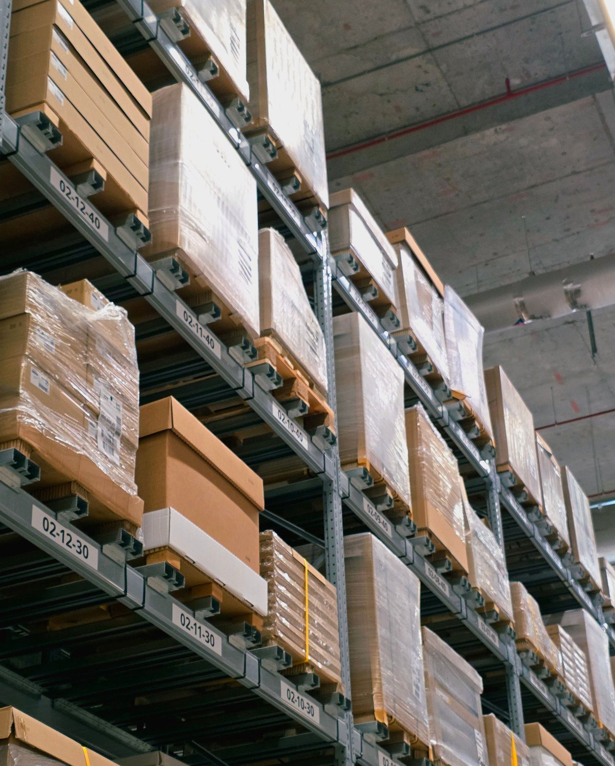 Cardboard boxes stacked and wrapped in a warehouse