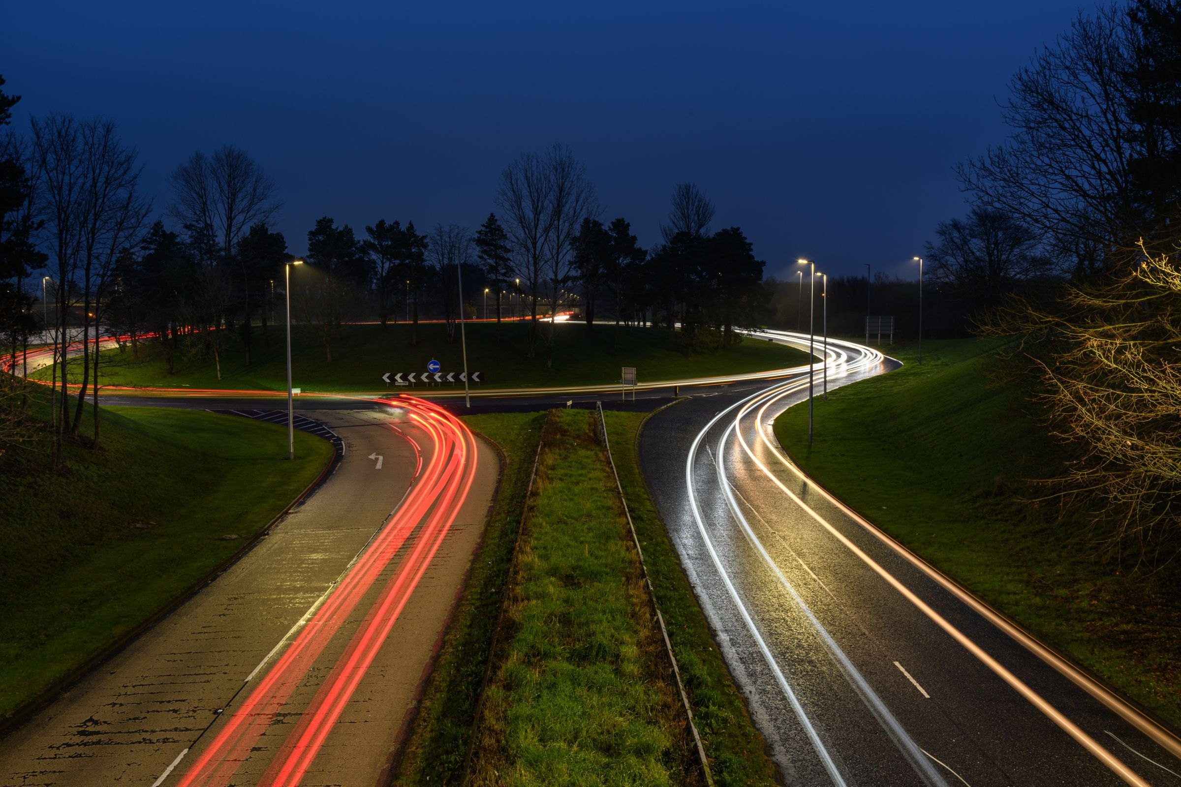 Light trails from traffic on a dual carriageway at night